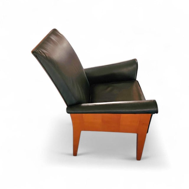 Paramount chair by philippe starck / black leather for driade / 1989 height 95 width 65 depth 67 cm