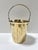 A petite vintage ice bucket crafted from silverplated brass, with a streamlined cylindrical body and hinged swing handle....