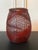 A Japanese Ikebana bamboo basket woven by artist Abe Motoshi (Japanese, b. 1942). Constructed with lacquered reddish...