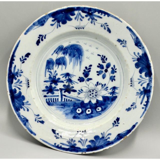 Fine quality late 18th-Century Delft plate. It is beautifully hand painted in traditional cobalt blue with a chinoiserie...