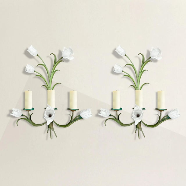 These vintage American tole sconces exude a delightful blend of whimsy and elegance, capturing the charm of tulip clusters...