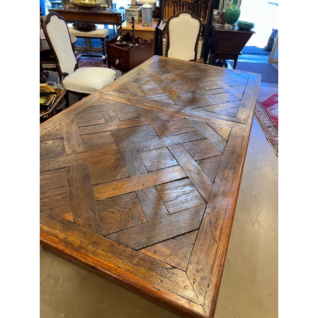 Interesting 18th century French parquet top table with a trestle base. This is a beautiful oak antique in excellent...