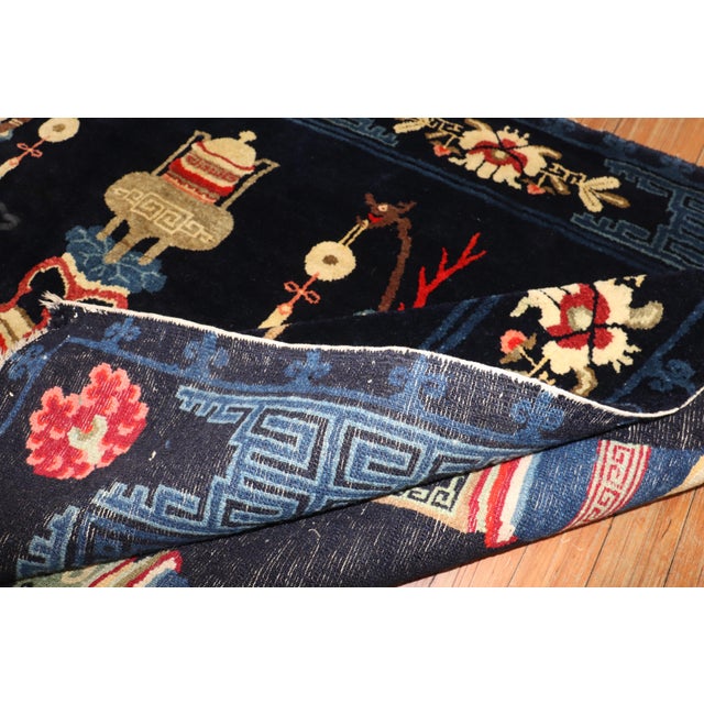 An early 20th century Chinese Peking rug Measures: 4'5'' x 6'8''.