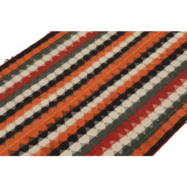 This vintage 4x7 Persian kilim is handwoven in wool, and originates circa 1950-1960. On the Design: This design remarks...