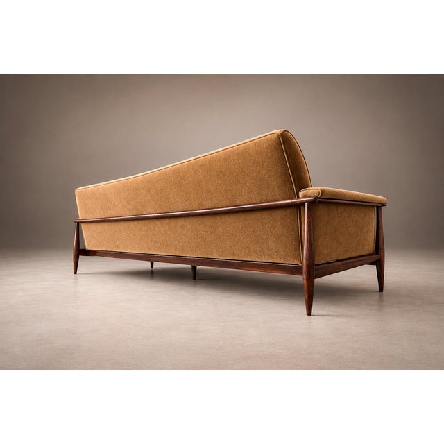 : A sculptural expression of Brazilian modernism, the “Canoa” sofa by Liceu de Artes e Ofícios balances architectural...