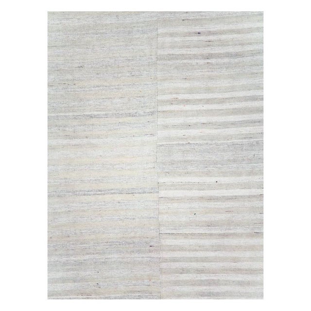 A vintage Turkish flatweave Kilim room size carpet handmade during the mid-20th century in shades of grey and silver....