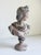 A stately bust of the Apollo Belvedere, a celebrated Greek and Roman god of light, music, and truth. This sculpture...