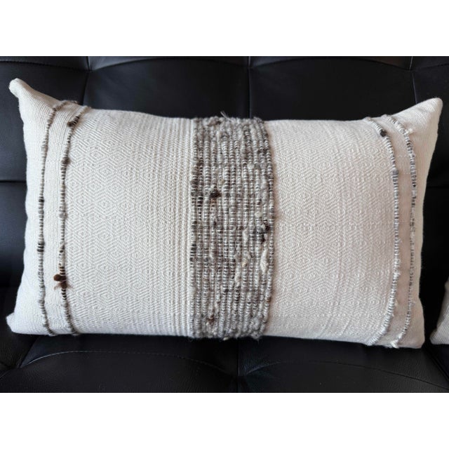 Description: Elegant pair of authentic RH (Restoration Hardware) lumbar pillows featuring a beautifully textured woven...