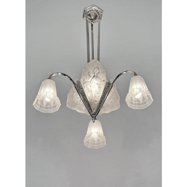 B. Morin & Degué A beautiful French 1925-1935 art deco chandelier in nickel plated solid brass holding 3 slip shades and 3...