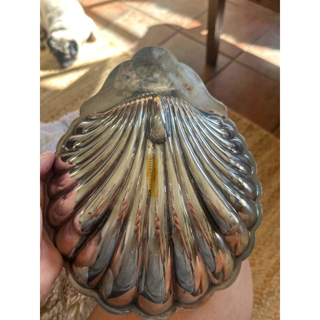 An elegant silver plated scallop shell dish from Roberts Jewelers of Dallas. Beautifully engraved with a family crest at...