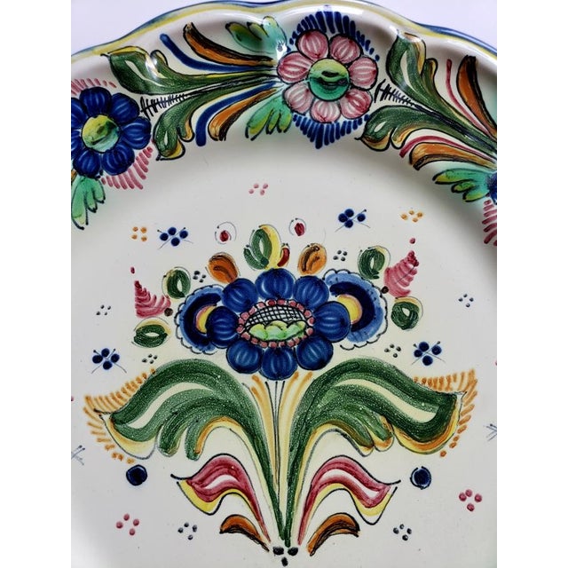 Spanish faience majolica charger, hand painted with exuberant polychrome floral decoration in cobalt blue, green, rose,...