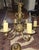 Lovely solid brass six-arm chandelier with detailed ceiling escutcheon. Wired and working. Faux drip candle socket covers...