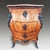 An elegant Italian Venetian serpentine commode dating to circa 1800, finely constructed in walnut and enriched with...