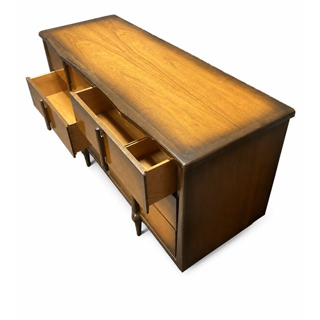 A striking example of mid-century modern craftsmanship, this beautiful Tri-Bond Furniture dresser showcases exceptional...