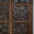 Antique Indian Carved Teakwood and Iron Door, the frame with decorative nailheads, a carved center style with brass...