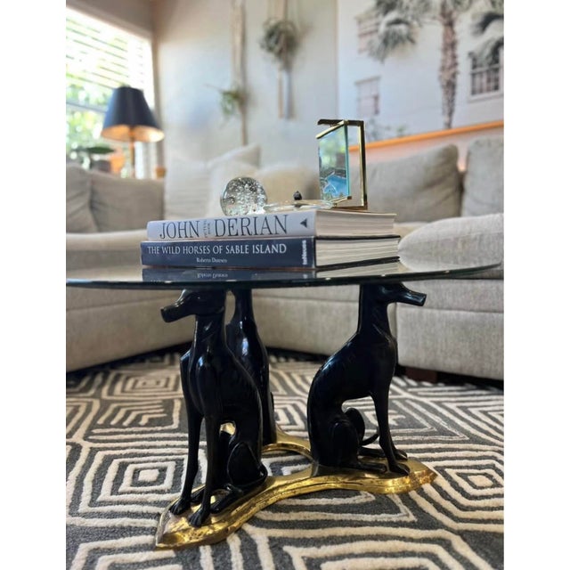 Attributed toMaitland Smith Bronze Brass and Glass Greyhound Whippets Art Deco Coffee Table, circa 1980. Cast bronze...