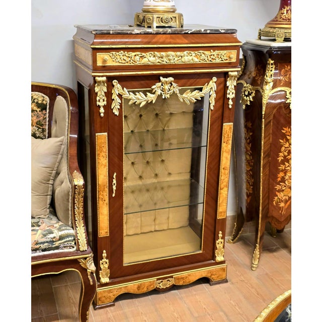 Bring refined European elegance to your interior with this French Empire-style display cabinet, crafted from richly...