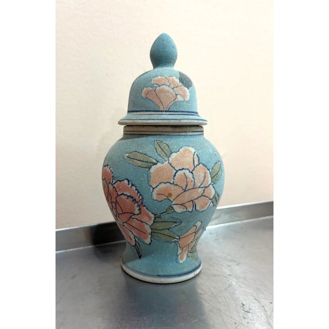 1970s-80s asian-style saltware pottery blue floral lidded urn/vase. Some surface scuffing/discoloration around inside rim...