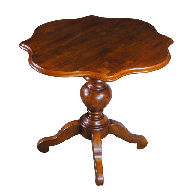 An exquisite pair of Henredon French inspired tables, circa 1980s. Made from naturally distressed walnut with a beautiful...