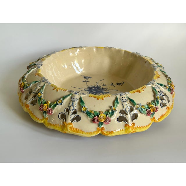 A richly ornamented Italian Majolica centerpiece bowl by Agostinelli & Dal Prà of Nove, Italy, dating to circa...