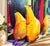 A vibrant original painting by American artist Robert Burridge, Still Life with Wine and Pears (2003), featuring an...