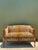 This striking vintage settee masterfully blends the refined elegance of a Napoleon III silhouette with the bold,...