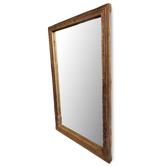 Antique Indian full-length aged hand-carved teak framed mirror. The deeply textured frame is decorated with layered bands...