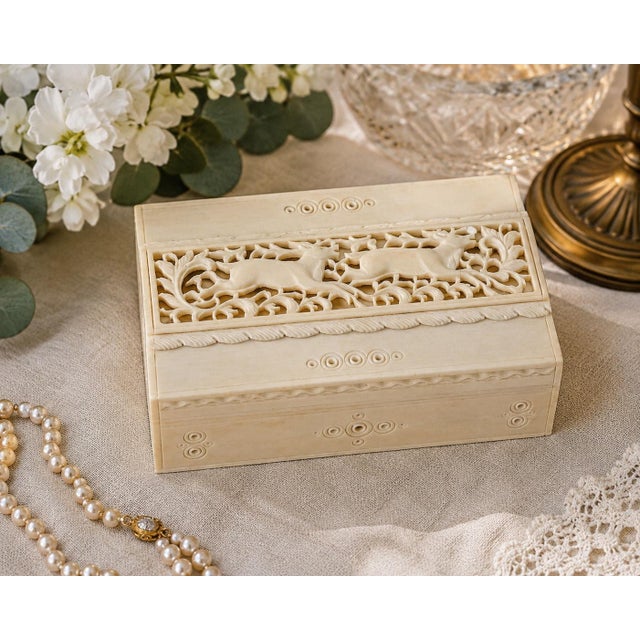 Elegant vintage Asian-style jewelry or keepsake box featuring finely hand-carved bone overlay panels with an intricate...