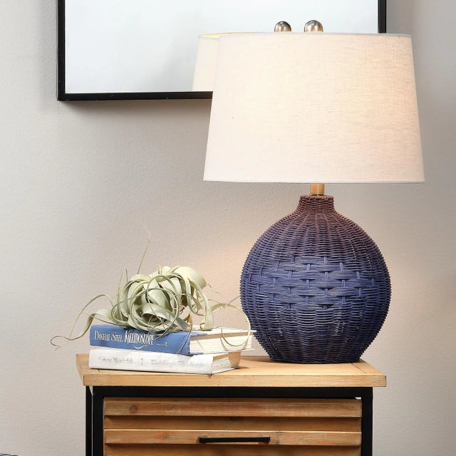 Bring the waterfront inside your home with this gorgeous table lamp. Its body is made of handwoven rattan with a subtle...