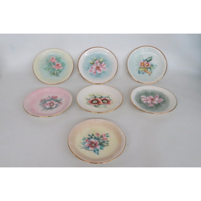 This lovely Set of 7 trinket dishes is made of porcelain. These darling dishes feature gorgeous floral motifs against...