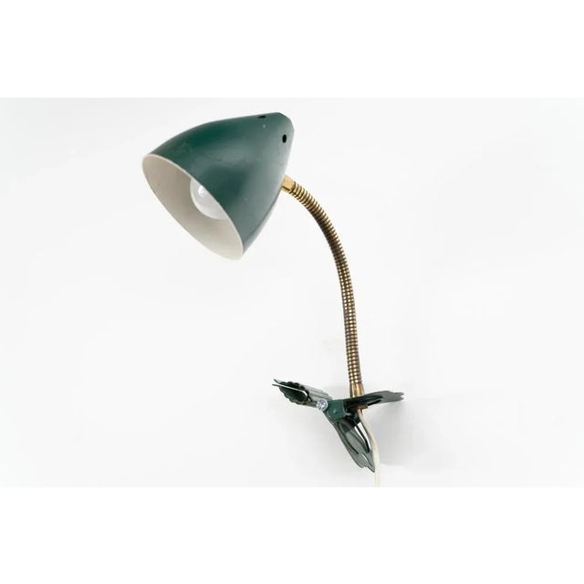Ukkie I clamp light by H. Busquet for Hala Zeist. The light is made out of a green coated metal and comes with a clamp...