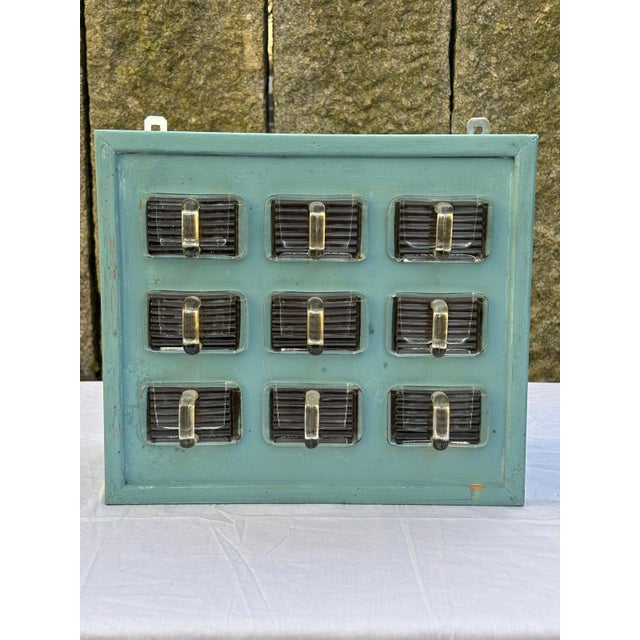 Vintage wall shelf/small apothecary cabinet made of turquoise wood, equipped with 9 rectangular glass jars, ideal for the...