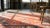 Textile 1920s Red Rust Rustic Pomegranate Antique Central Asian Khotan Rug 5'2" X 8'3" Knotted Wool Carpet For Sale - Image 7 of 8