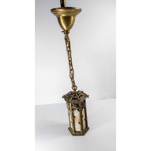We are selling this nice mid-century Arts and Crafts style lamp. This hanging pendant light features Arts & Crafts design...