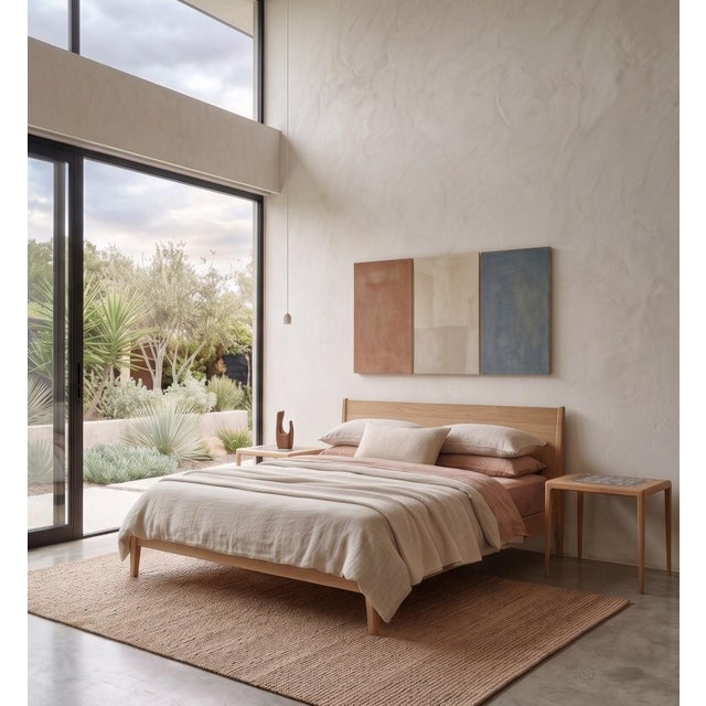 Elegant pair of oak side tables designed by Johannes Andersen in the 1960s, featuring beautiful ceramic tiles made for...