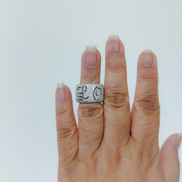 Beautiful white diamond round pave wide band that says "Love You". Handmade in 18k white gold. Ring size 5.25. Metal:...