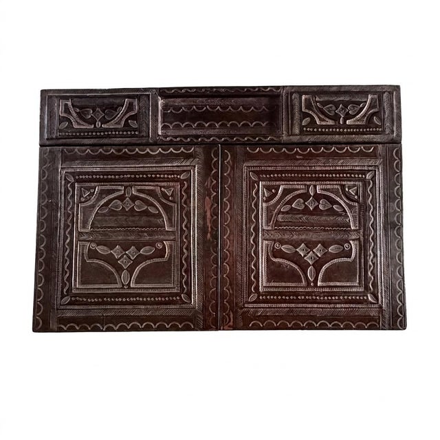 A large vintage writing desk pad or desk blotter, entirely covered in richly hand-tooled leather and dating from the...