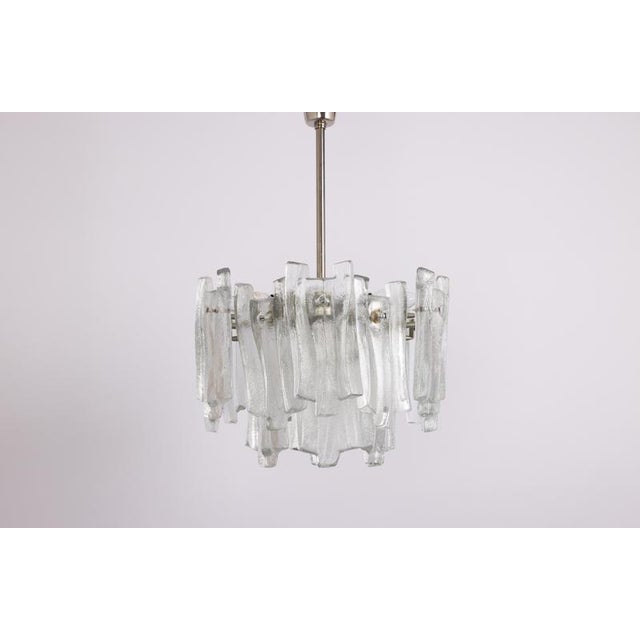 A stunning chandelier with brilliant ice glasses made by kalmar (series: fuente), germany, manufactured, circa 1970-1979....