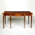 The rectangular serpentine-fronted top with outset corners and broad satinwood banding over a finely-figured frieze...