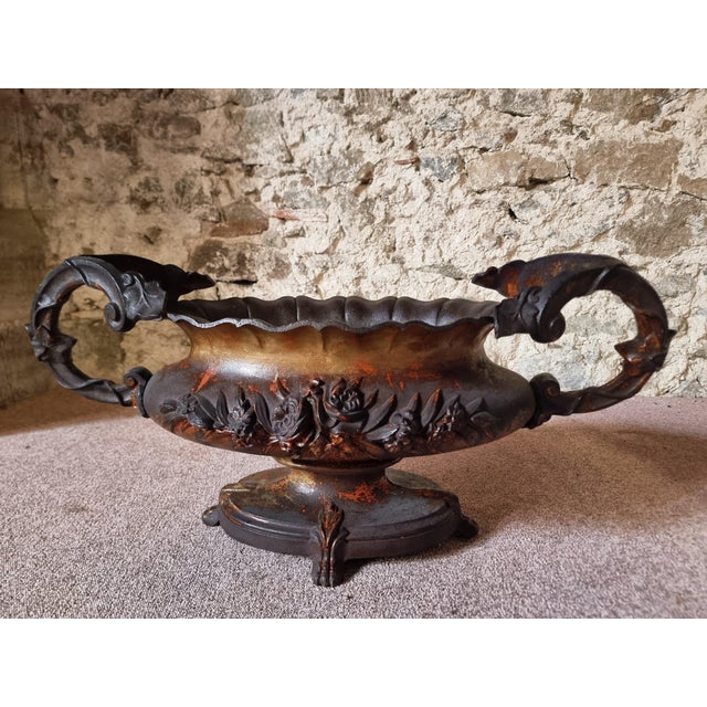Large antique cast iron jardinière, originating from France and dating to the period circa 1900. The jardinière consists...