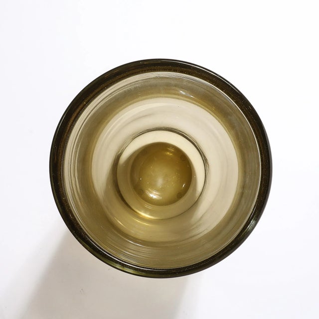 This striking Modernist Hand-Blown Murano Glass Vase in Smoked Amber originates from Italy during the 21st Century. It...