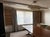 Pair of elegant custom floor-length drapery panels in a warm champagne/taupe fabric with a subtle metallic sheen and...