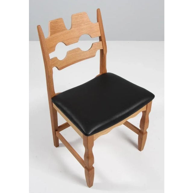 A striking dining chair by Henning Kjærnulf, made of oak and ready for you to upholster Refreshing design with bold...