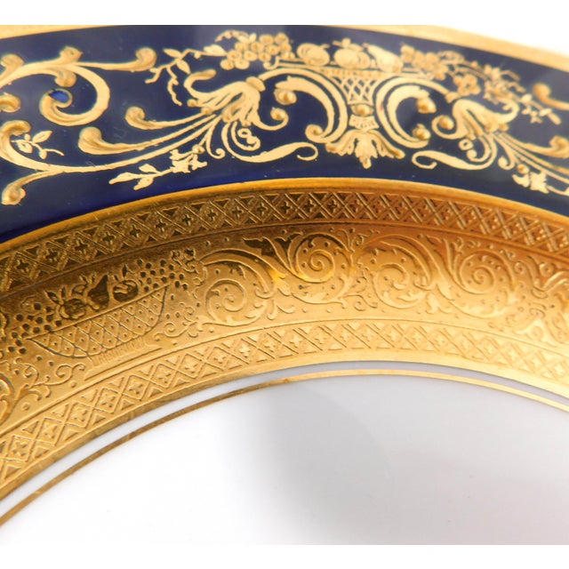 This is a white Black Knight salad plate in BLK190. The plate has white center with a gold medallion, a wide gold...