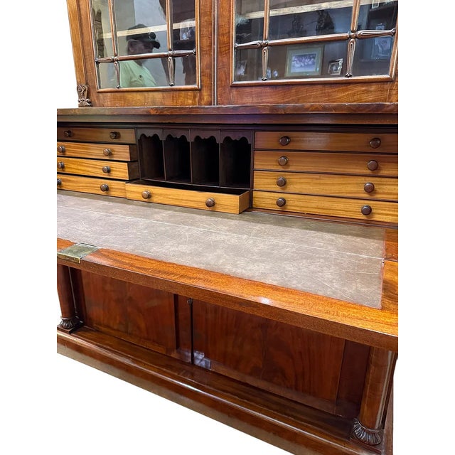 This Antique English Large Mahogany Secretaire Bookcase is a stunning piece of Victorian-era furniture, crafted from rich...
