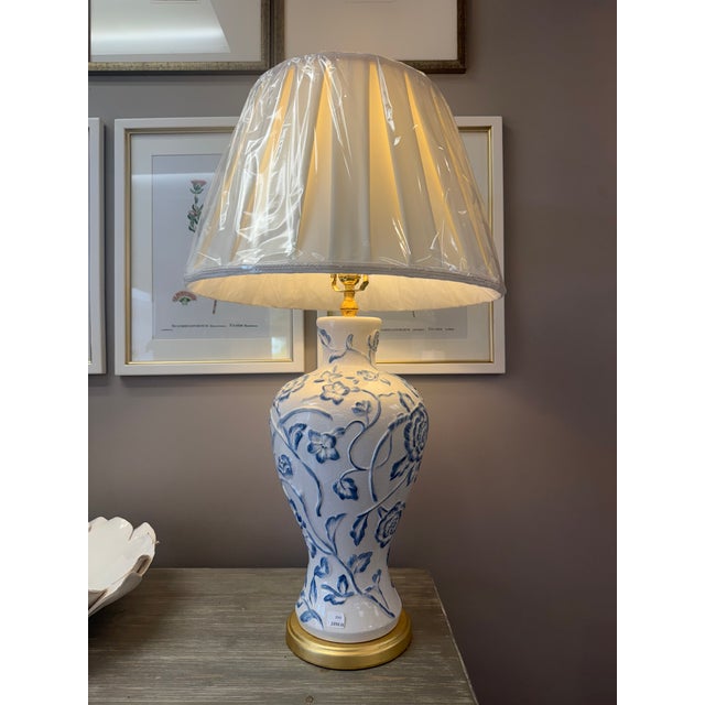 This large table lamp adds so much charm and softness to the space. The delicate blue florals over the white base feels...