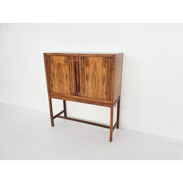 Super high quality and elegant bar cabinet or dry bar in rosewood by Torbjørn Afdal for Mellemstrands Møbelfabrik. This...