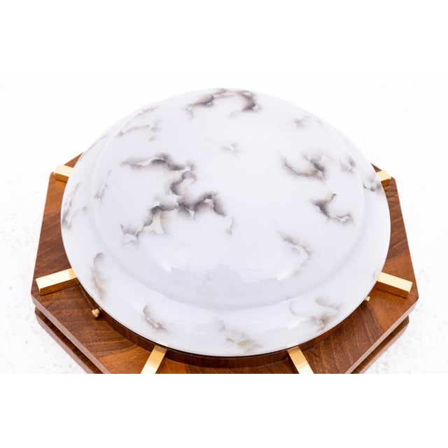 Art Deco lamp/ceiling lamp, Poland, 1950s. Ceiling lamp on a wooden base with a geometric form characteristic of the Art...