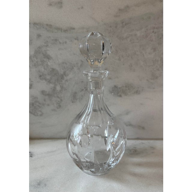 Vintage clear cut glass decanter or liquor bottle with glass stopper. A timeless and elegant addition to any bar cart or...
