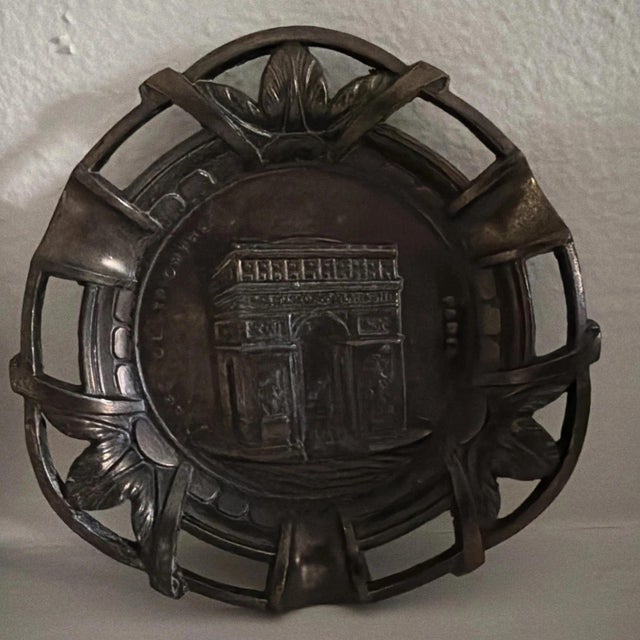 These vintage brass ashtrays/cendriers or candy dishes feature the Arc de Triumphed and the historic Cathedral of Notre...